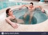 couple-relaxing-in-a-hot-tub-M7AT91.jpg