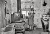 a little girl in her kitchen back in the 1930’s during the Great Depression..jpg