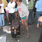 Barefoot street chalk artist with dirty feet and legs