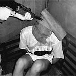 Brit Gun to Prisoner Head