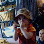Croix playing the harmonica